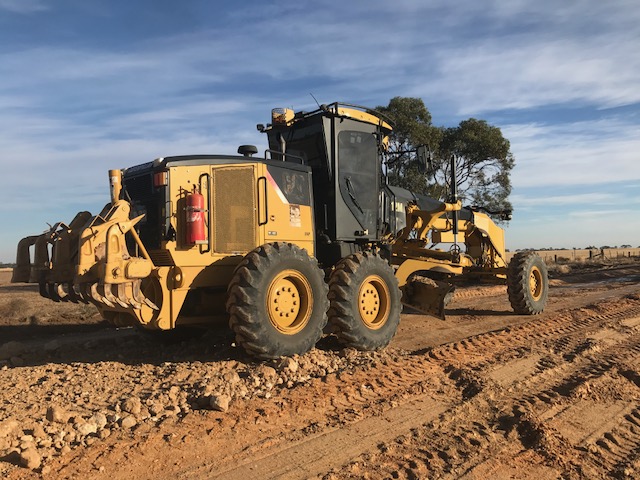 Grader on dirt